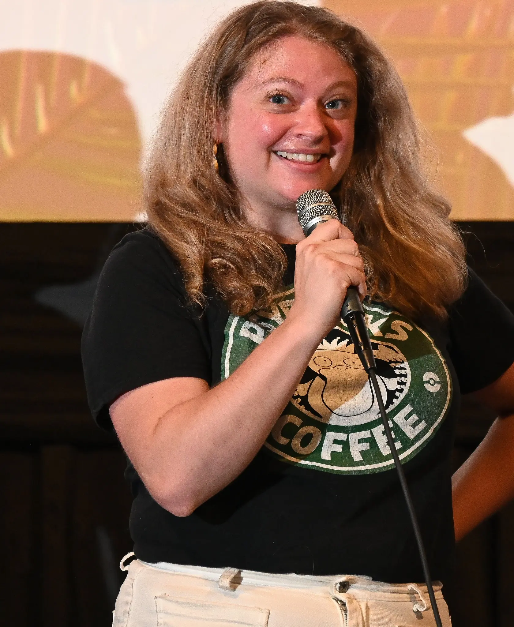 DudeZ cast member smiling onstage at LIIFE